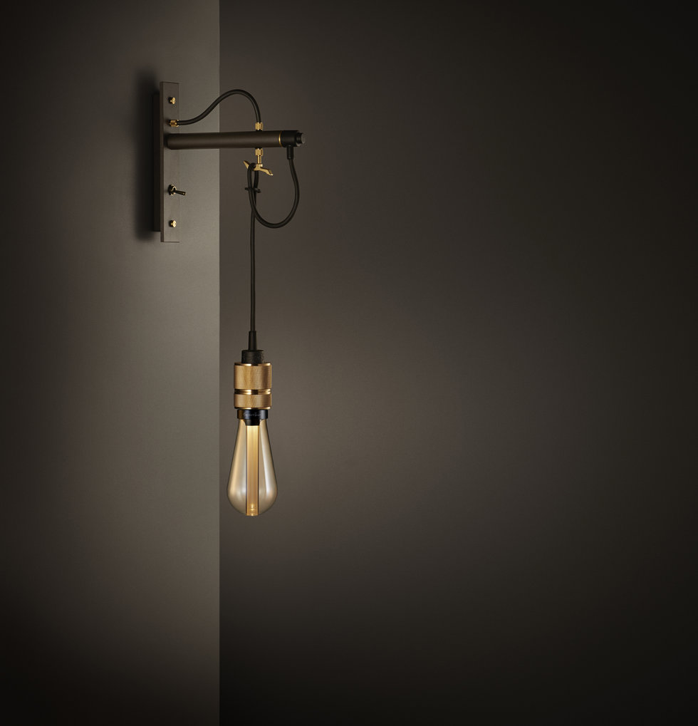 Bronze wall light with exposed bulb