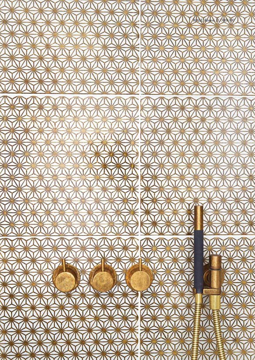 Gold bathroom tiles and brass taps