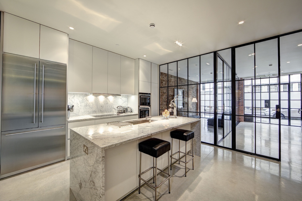 Large white and grey marble island in kitchen