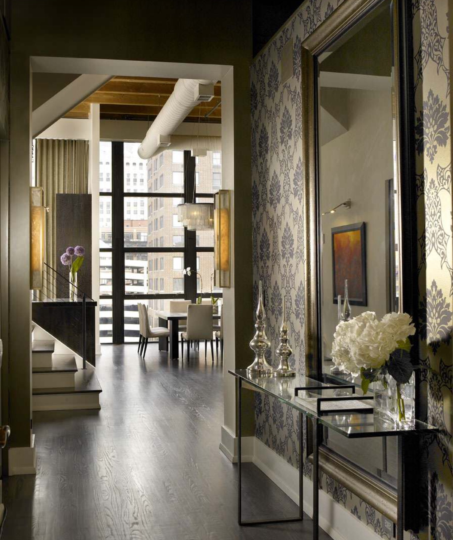 Accent wallpaper with large mirror hallway