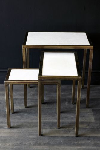 White and bronze nesting tables